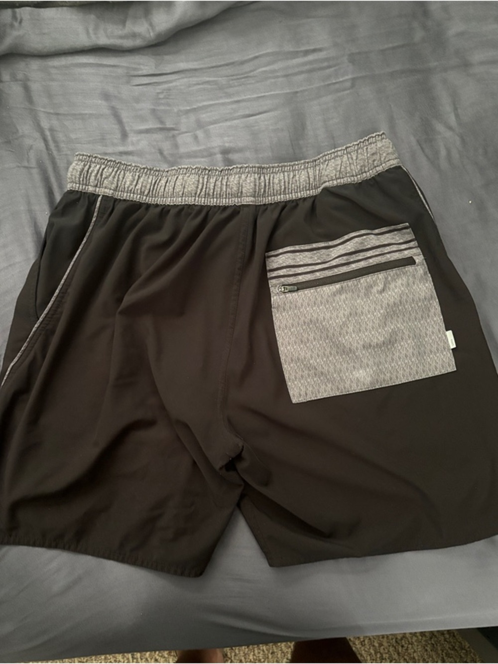 Vuori Men's Athletic Shorts in Black with Heather Gray Pocket